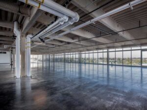 Unfinished public works building ready for insulation installation.